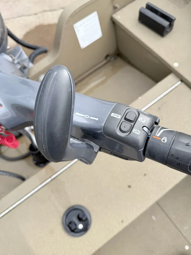 Slide: The Image of Close-up of the control handle on a G3 Outfitter V177 T boat. - 31