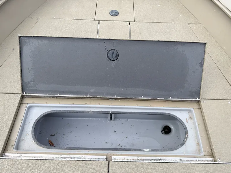 Slide: The Image of G3 Outfitter V177 T 2020 boat with open storage compartment. - 4