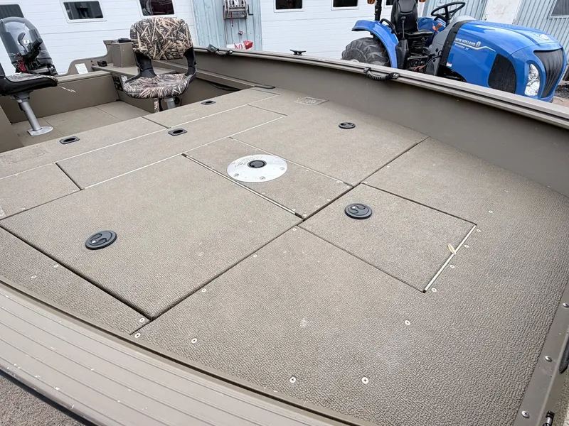Slide: The Image of Interior view of a 2020 G3 Outfitter V177 T boat with seating and storage. - 6