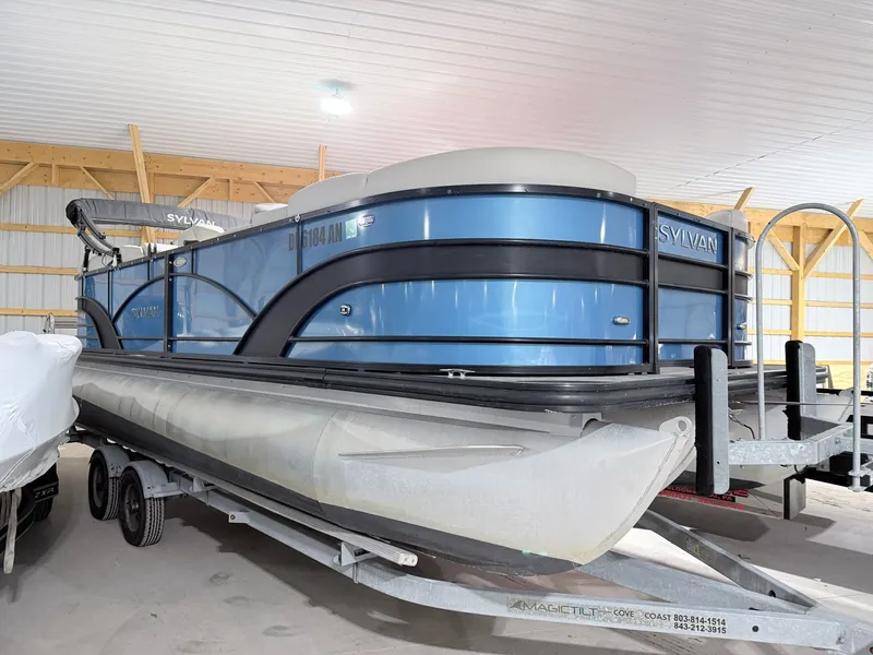 The Image of 2018 Sylvan 8522 LZ LES pontoon boat in storage facility. - 1
