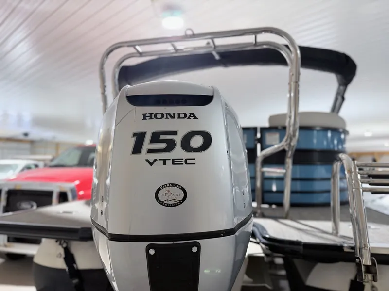 Slide: The Image of Honda 150 VTEC outboard motor on Sylvan 8522 LZ LES boat. - 12