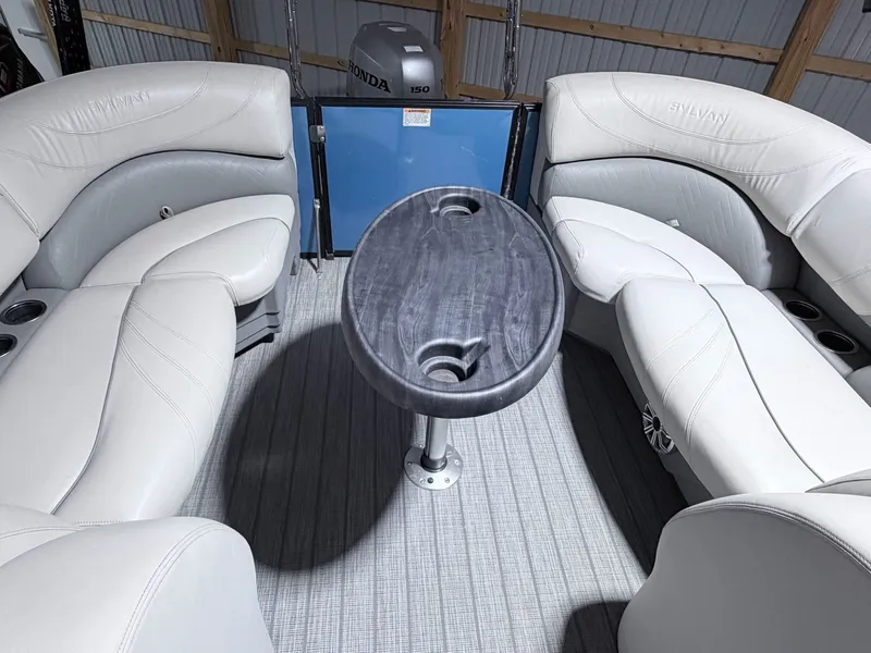 Slide: The Image of Interior of a 2018 Sylvan 8522 LZ LES pontoon boat with table. - 13