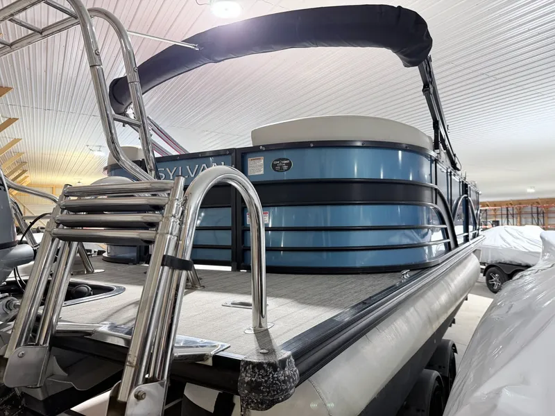 Slide: The Image of 2018 Sylvan 8522 LZ LES pontoon boat in storage facility. - 14