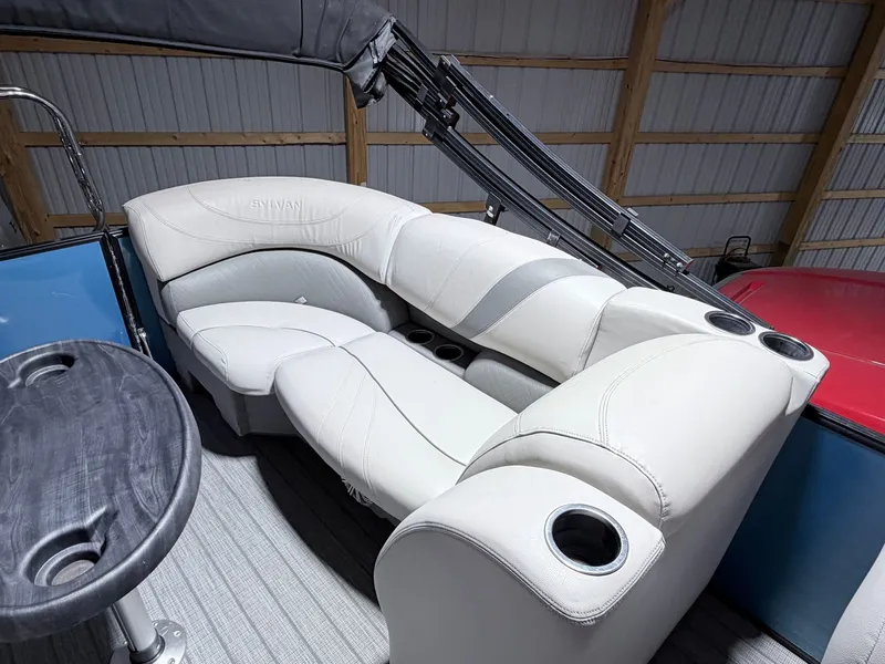 Slide: The Image of Interior of a 2018 Sylvan 8522 LZ LES pontoon boat with white seating. - 16