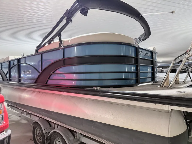 Slide: The Image of 2018 Sylvan 8522 LZ LES pontoon boat in storage facility. - 26