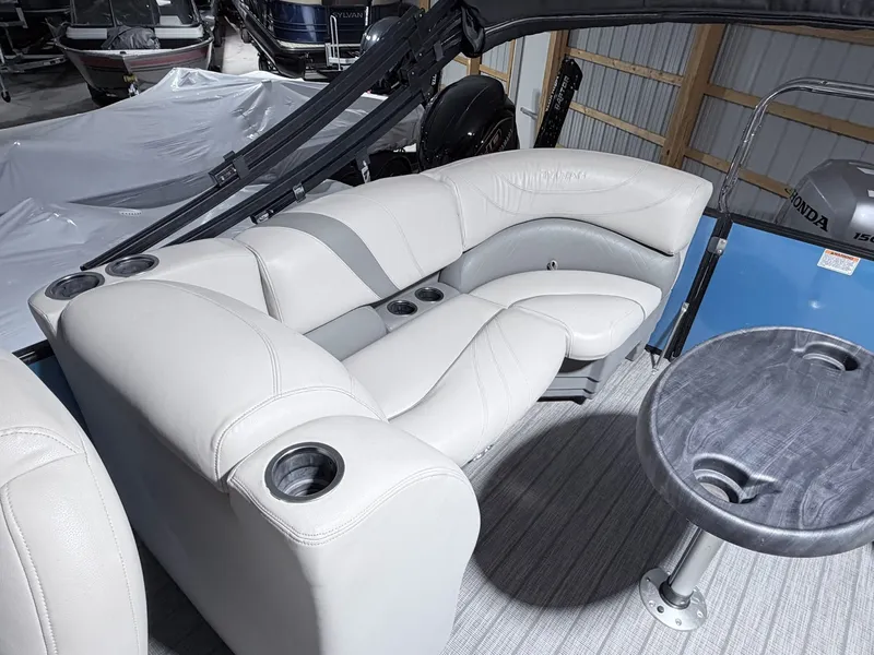 Slide: The Image of Interior of a 2018 Sylvan 8522 LZ LES pontoon boat with gray leather seating. - 4