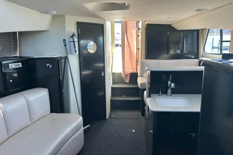 Slide: The Image of Interior of a 2003 Silverton 330 Sport Bridge yacht with modern furnishings. - 11