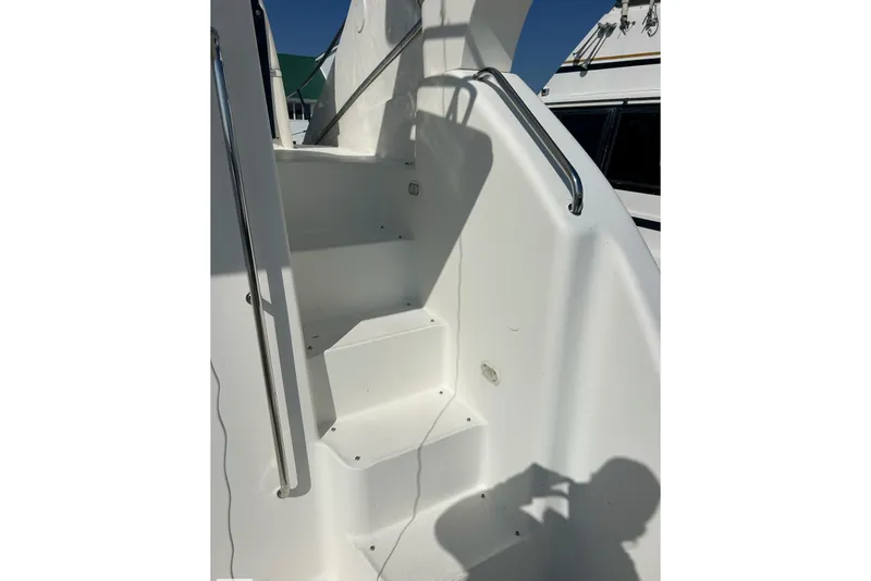 Slide: The Image of Staircase on 2003 Silverton 330 Sport Bridge yacht with stainless steel handrails. - 17