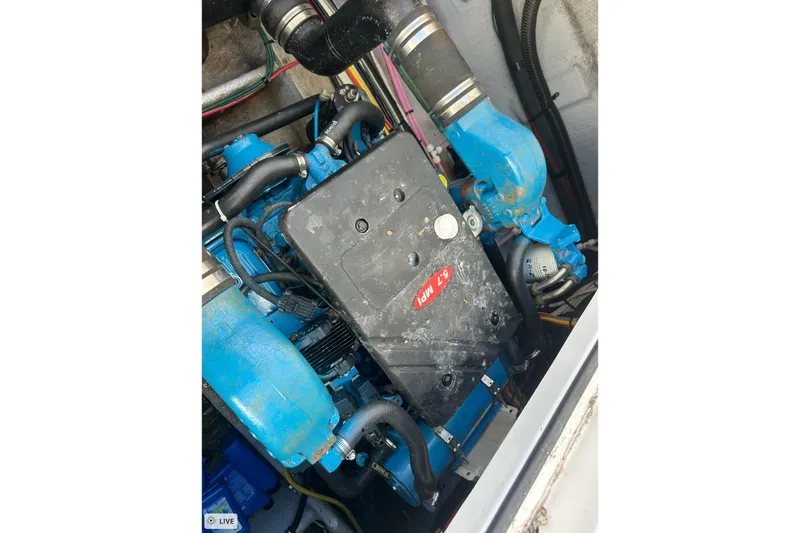 Slide: The Image of Engine compartment of a 2003 Silverton 330 Sport Bridge boat. - 19