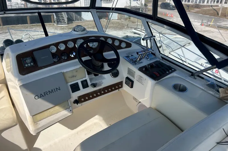 Slide: The Image of 2003 Silverton 330 Sport Bridge helm with Garmin navigation and control panel. - 6