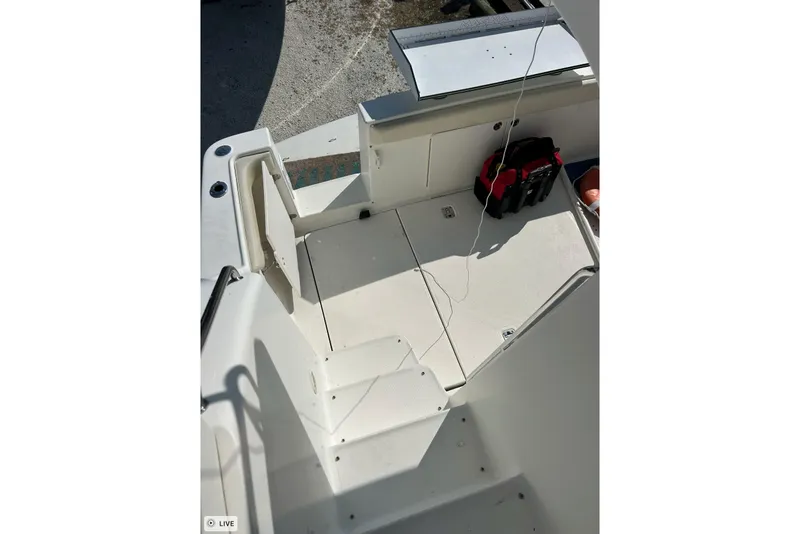 Slide: The Image of 2003 Silverton 330 Sport Bridge boat deck with storage compartments and equipment. - 7
