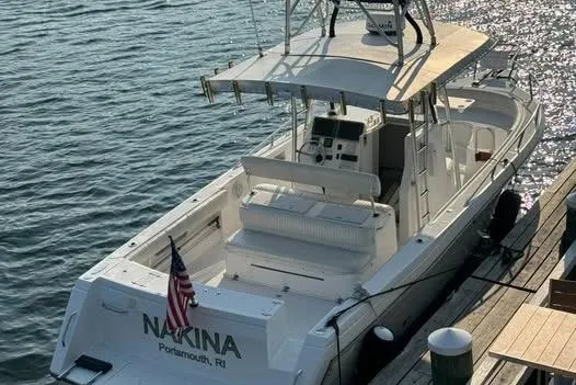 The Image of 2005 Stamas 310 Tarpon boat docked, rear view with American flag, Portsmouth, RI. - 1