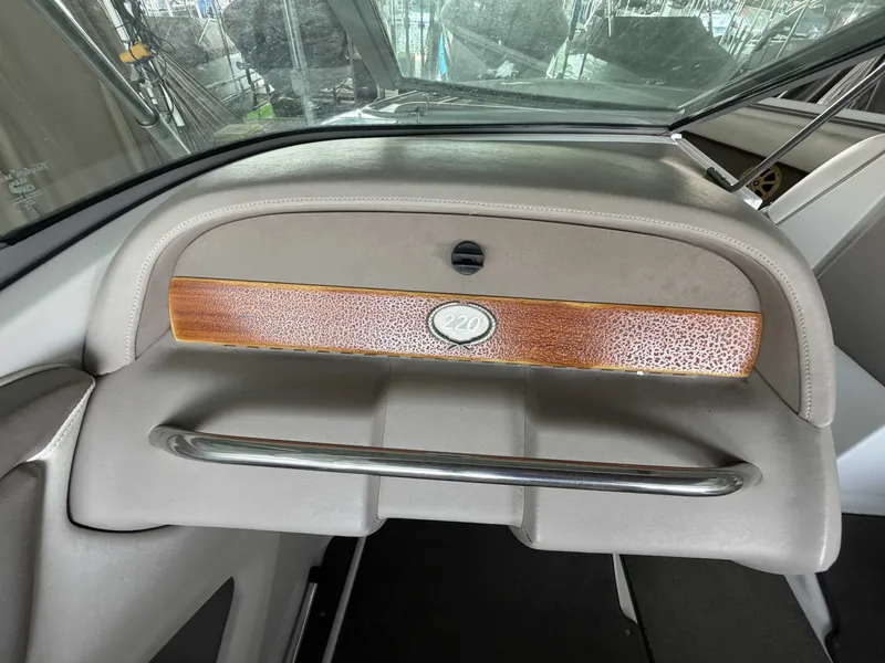 Slide: The Image of Interior view of a 2004 Cobalt 220 boat with wood trim. - 11