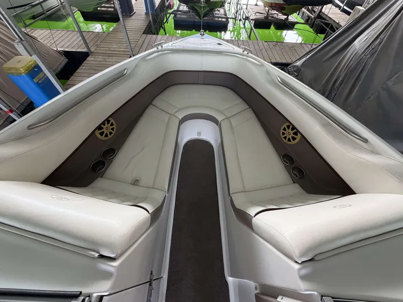 Slide: The Image of Interior of a 2004 Cobalt 220 boat with white seating. - 12
