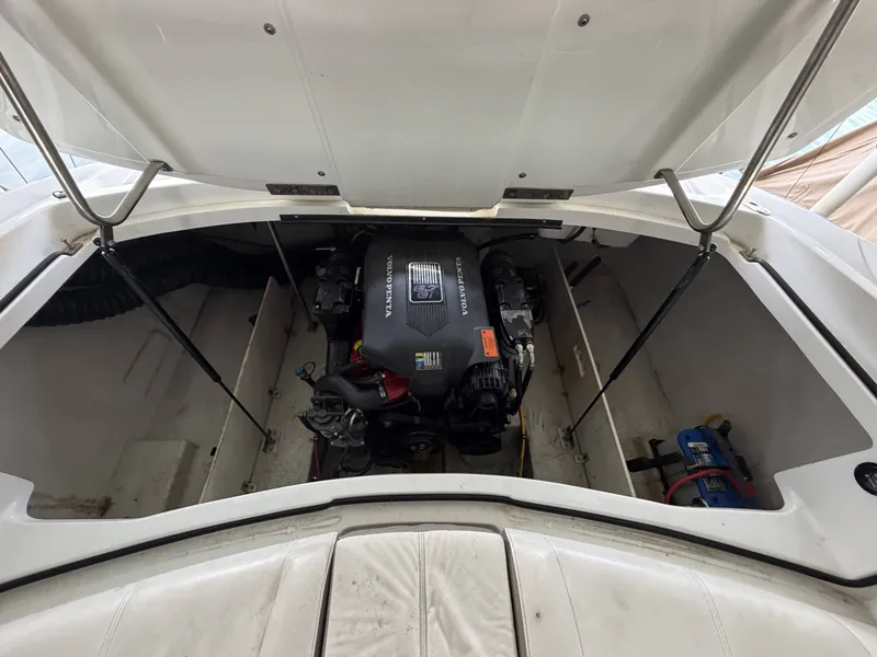 Slide: The Image of Engine compartment of a 2004 Cobalt 220 boat with Volvo Penta engine. - 13