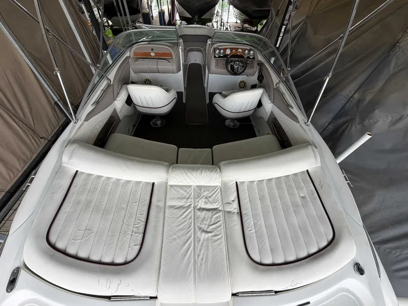 Slide: The Image of Interior view of a 2004 Cobalt 220 boat with white seating. - 5