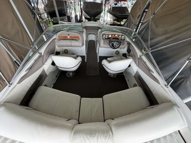 Slide: The Image of Interior of a 2004 Cobalt 220 boat with white seating. - 6