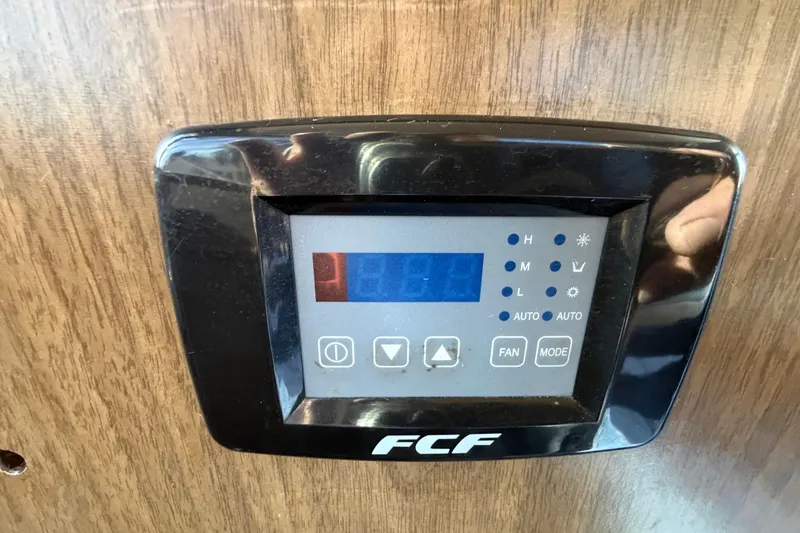 Slide: The Image of Control panel on 1973 Chris-Craft 30 Tournament FB boat, featuring FCF display and buttons. - 20