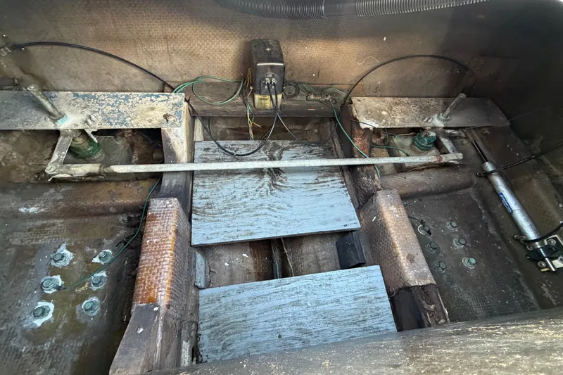 Slide: The Image of Interior view of a 1973 Chris-Craft 30 Tournament FB boat showing mechanical components. - 26