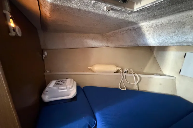 Slide: The Image of Interior cabin of 1973 Chris-Craft 30 Tournament FB with marine safety equipment. - 18