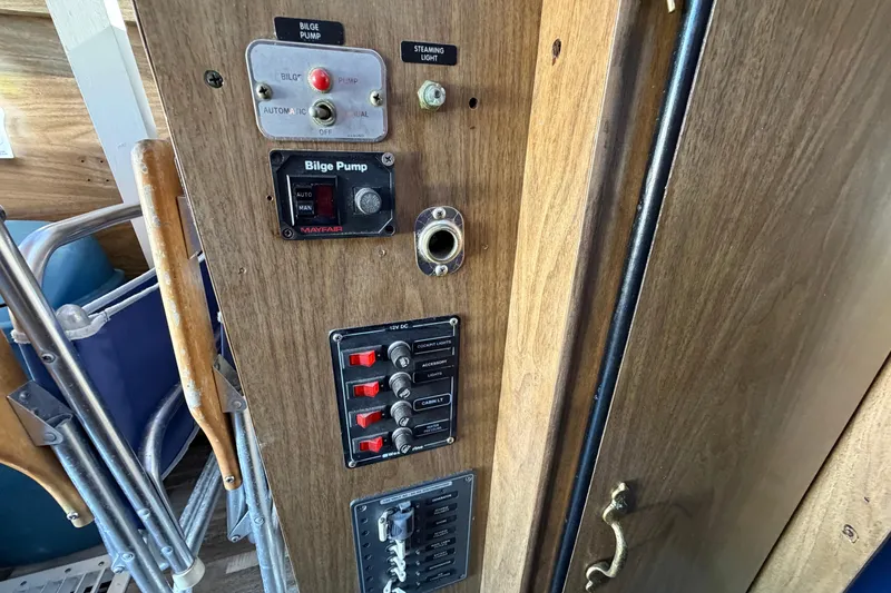 Slide: The Image of Control panel of a 1973 Chris-Craft 30 Tournament FB boat with bilge pump switches. - 19