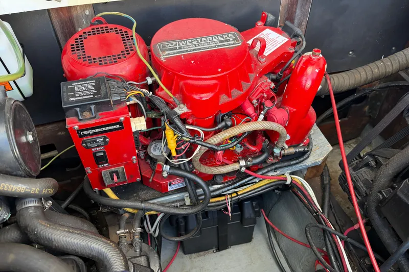 Slide: The Image of Red Westerbeke engine in a 1973 Chris-Craft 30 Tournament FB boat. - 30
