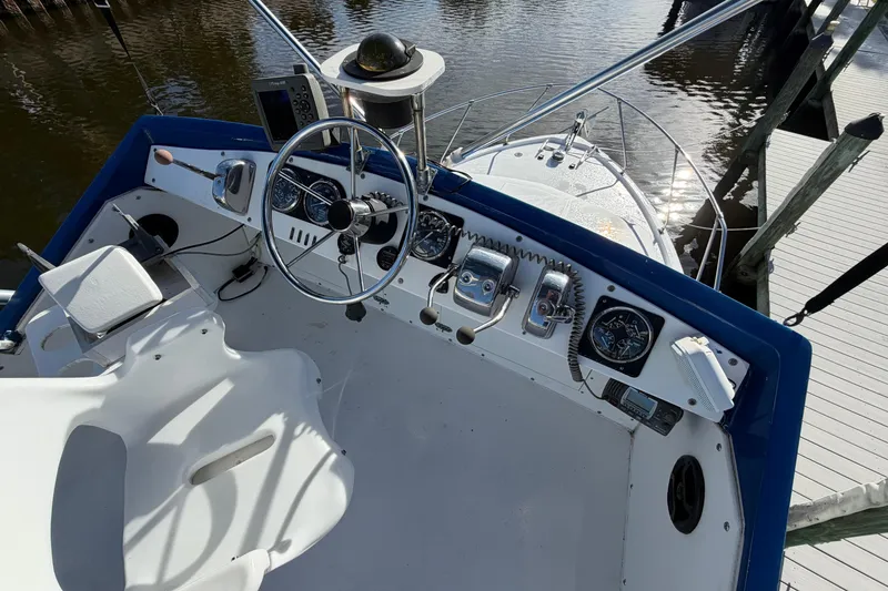 Slide: The Image of 1973 Chris-Craft 30 Tournament FB boat helm with steering wheel and controls. - 8