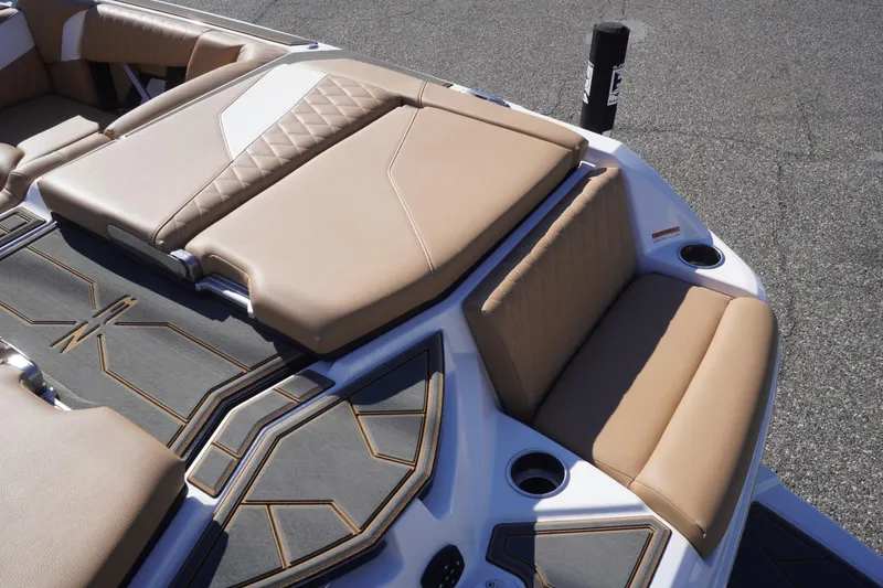 Slide: The Image of 2025 Tigé Z3 boat interior with tan seating and modern design elements. - 13