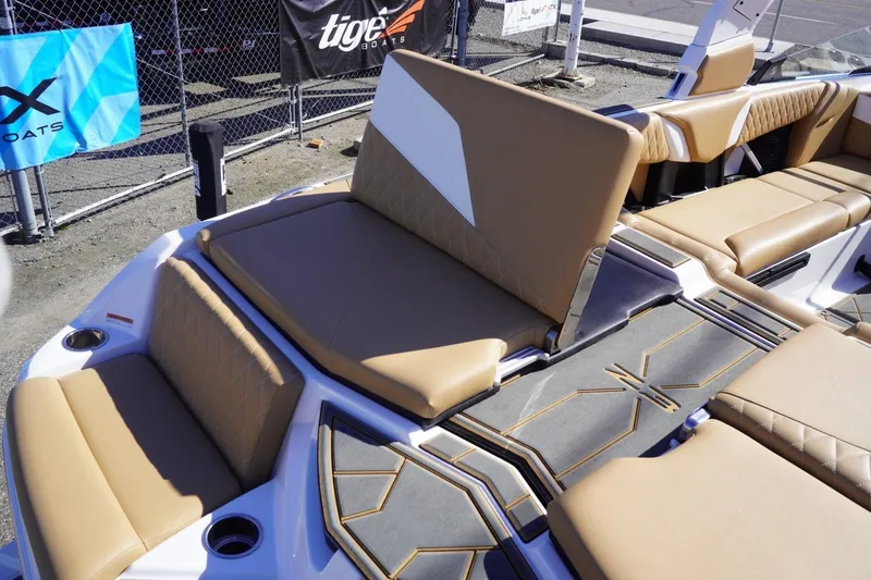 Slide: The Image of 2025 Tigé Z3 boat interior with tan seating and modern design elements. - 15