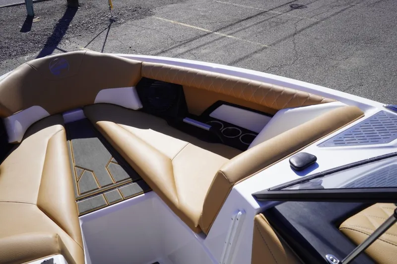 Slide: The Image of 2025 Tigé Z3 boat interior with tan seating and cup holders. - 17