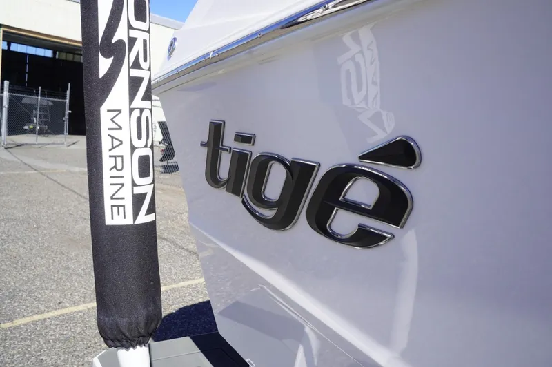 Slide: The Image of 2025 Tigé Z3 boat with Johnson Marine branding in a marina setting. - 28