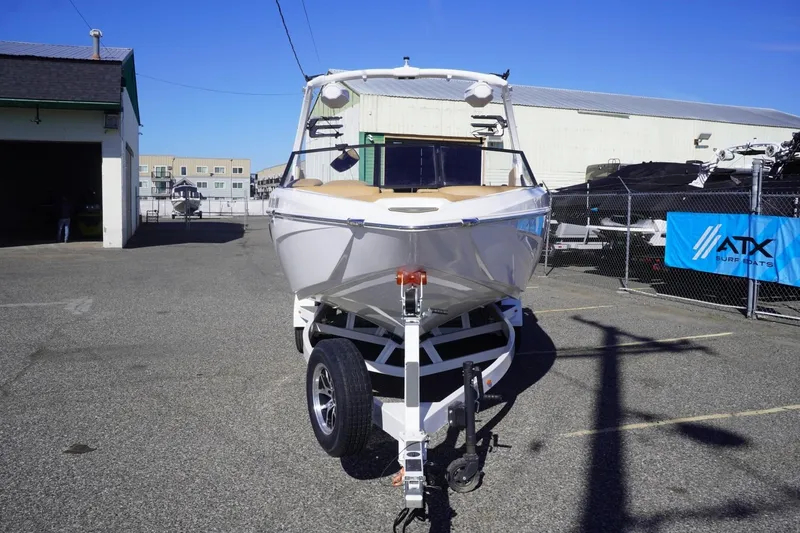 Slide: The Image of 2025 Tigé Z3 boat on trailer in marina parking lot, sunny day. - 3