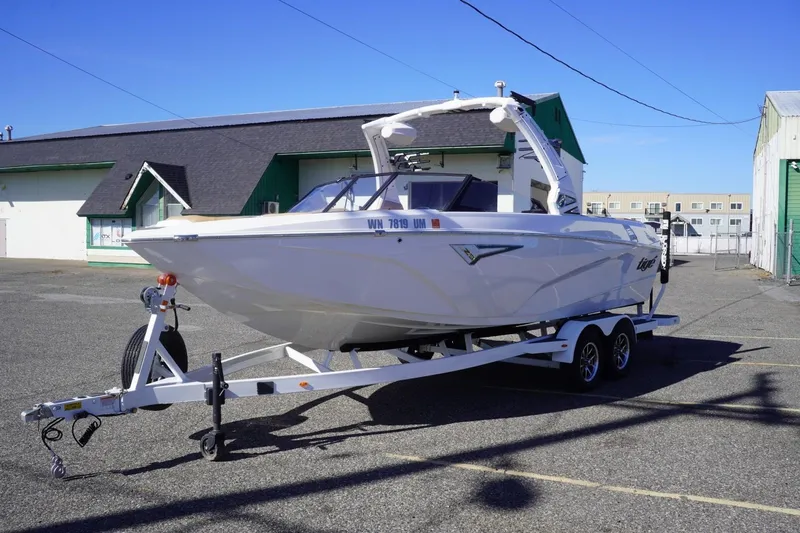 Slide: The Image of 2025 Tigé Z3 boat on trailer in parking lot, sunny day. - 5