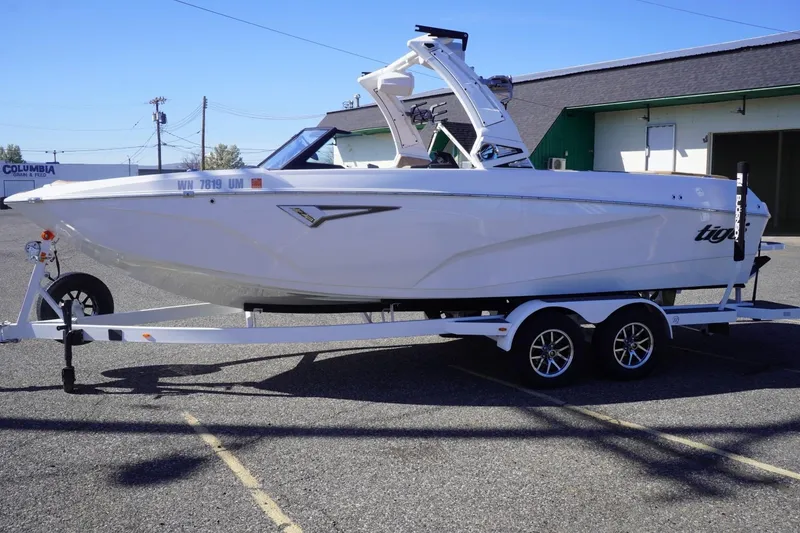 Slide: The Image of 2025 Tigé Z3 boat on trailer, parked outdoors, showcasing sleek design and modern features. - 6