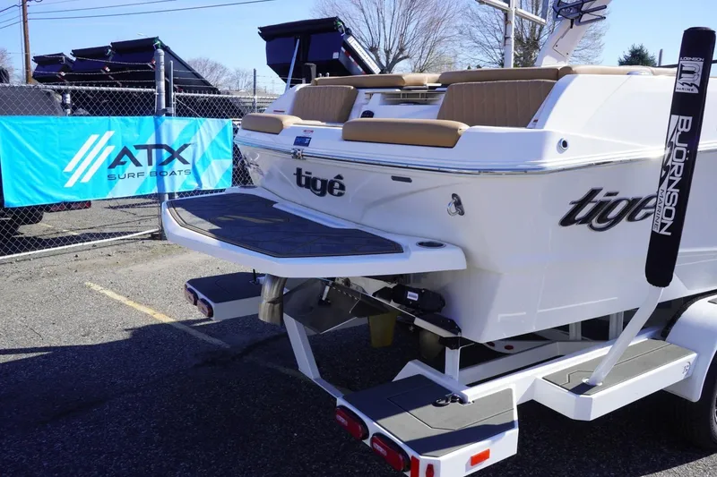 Slide: The Image of 2025 Tigé Z3 boat on trailer, displayed at ATX Surf Boats event. - 9