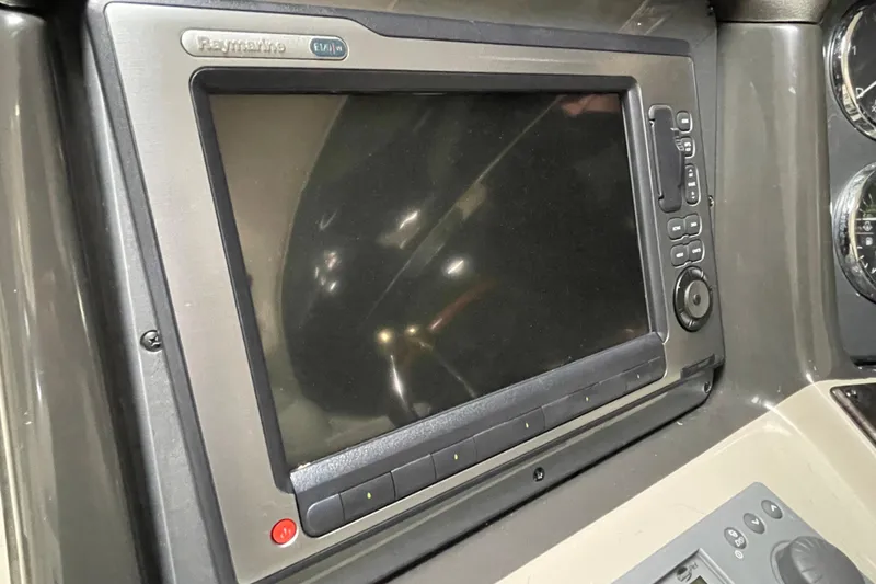Slide: The Image of Raymarine navigation display on 2007 Sea Ray 440 Express yacht dashboard. - 14