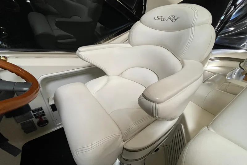 Slide: The Image of Luxurious white captain's chair on 2007 Sea Ray 440 Express yacht. - 25
