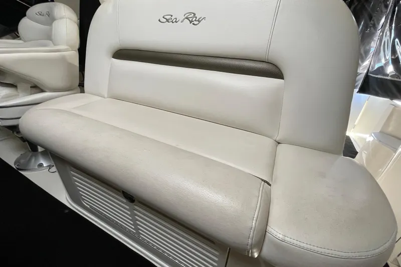 Slide: The Image of White leather seating on a 2007 Sea Ray 440 Express boat interior. - 26