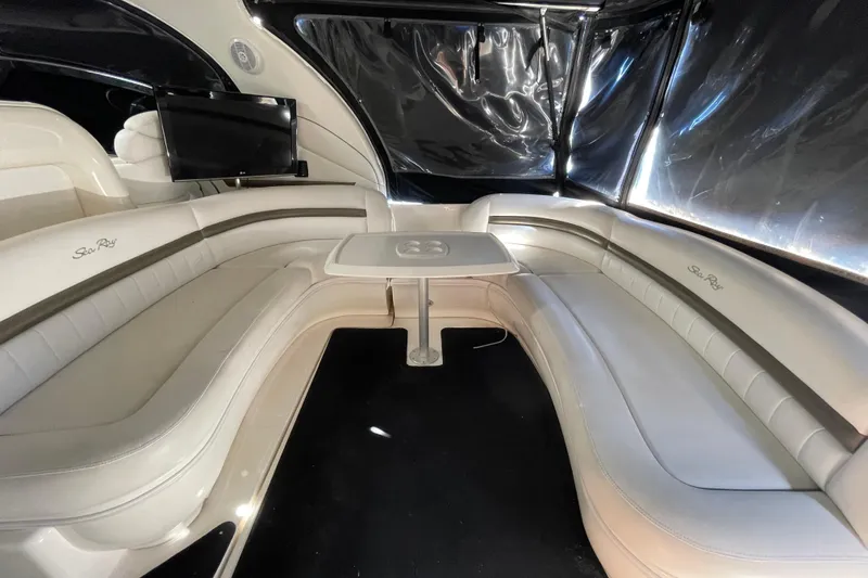 Slide: The Image of Luxurious interior of 2007 Sea Ray 440 Express yacht with plush seating and mounted TV. - 28