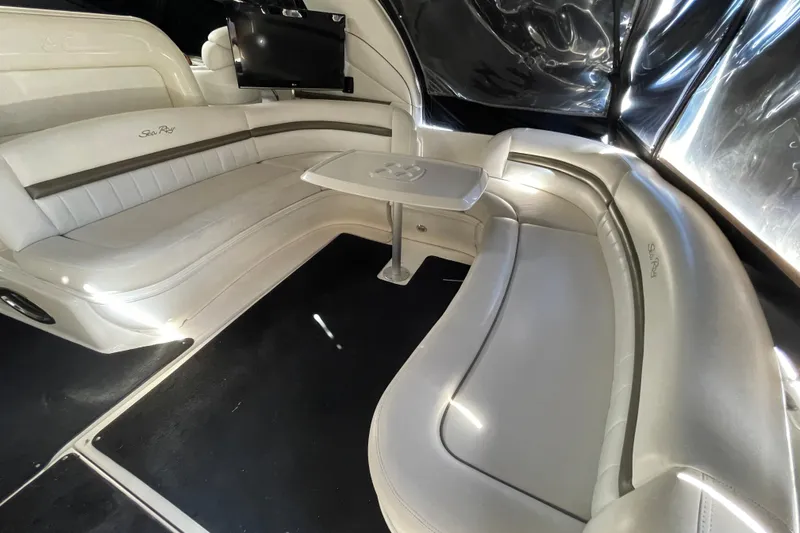 Slide: The Image of Luxurious interior of a 2007 Sea Ray 440 Express yacht with plush seating and table. - 29