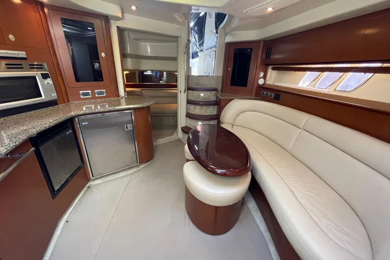 Slide: The Image of Luxurious interior of 2007 Sea Ray 440 Express yacht with modern kitchen and seating area. - 35