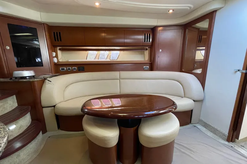 Slide: The Image of Luxurious interior of 2007 Sea Ray 440 Express yacht with elegant seating and wooden accents. - 37