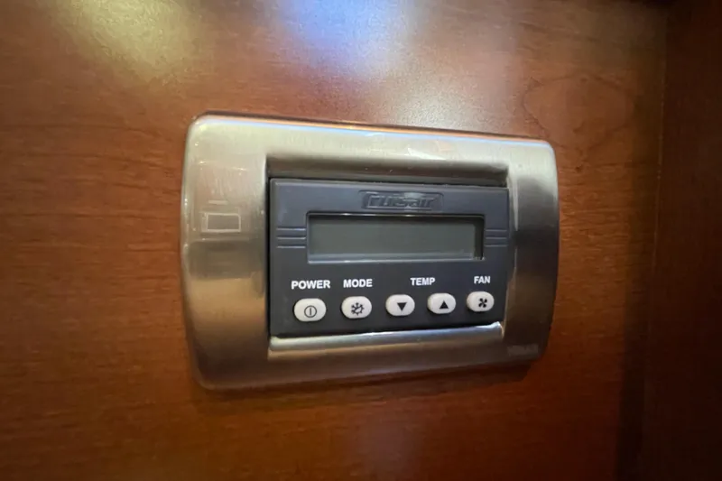 Slide: The Image of Thermostat control panel on 2007 Sea Ray 440 Express yacht interior. - 39