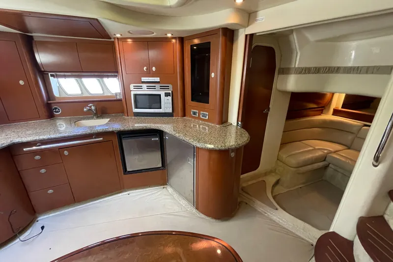 Slide: The Image of Luxurious 2007 Sea Ray 440 Express yacht interior with modern kitchen and cozy seating area. - 41