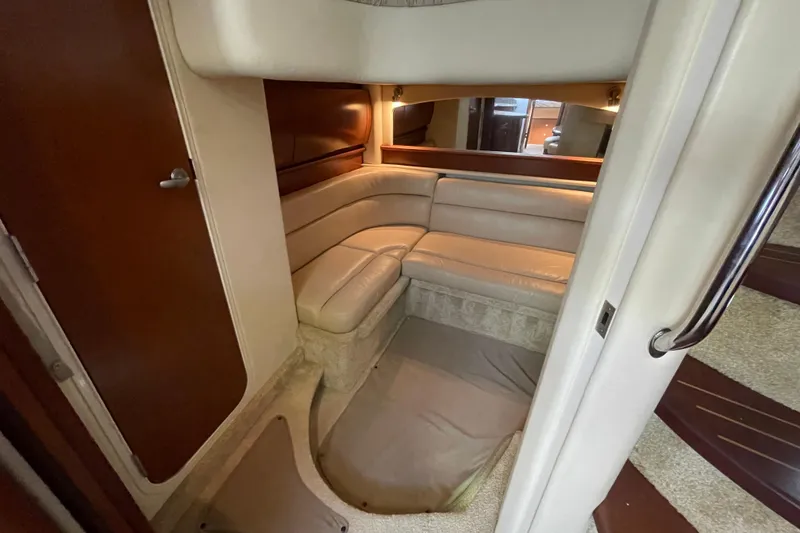 Slide: The Image of Interior of 2007 Sea Ray 440 Express yacht with beige leather seating. - 43