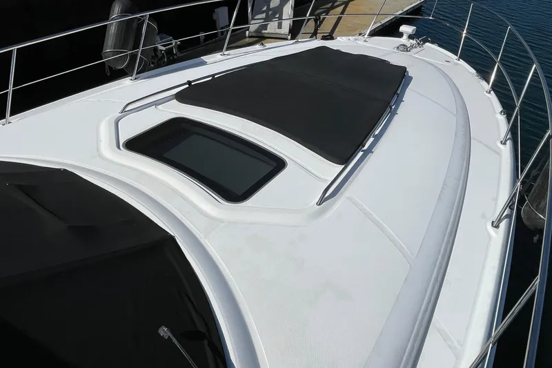 Slide: The Image of Bow view of 2007 Sea Ray 440 Express yacht with sleek design and sunroof. - 5