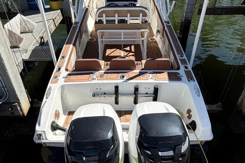 Slide: The Image of 1993 Fountain 31 Tournament Edition boat with dual engines docked at marina. - 15