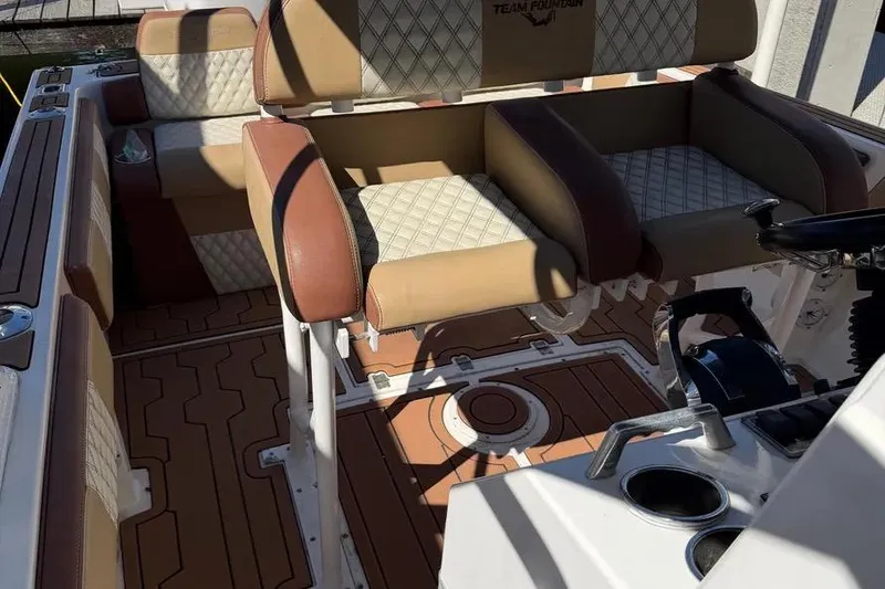 Slide: The Image of Interior of a 1993 Fountain 31 Tournament Edition boat with cushioned seating. - 7