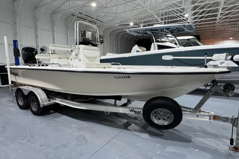 Slide: The Image of 2017 Mako 21 LTS boat on trailer in indoor storage facility. - 1