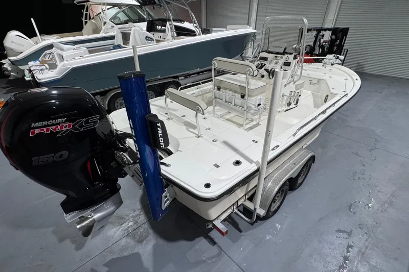 Slide: The Image of 2017 Mako 21 LTS boat with Mercury Pro XS 150 engine on trailer. - 18